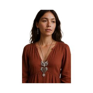 Vintage silver tone hinged owl pendant with rhinestone eyes.